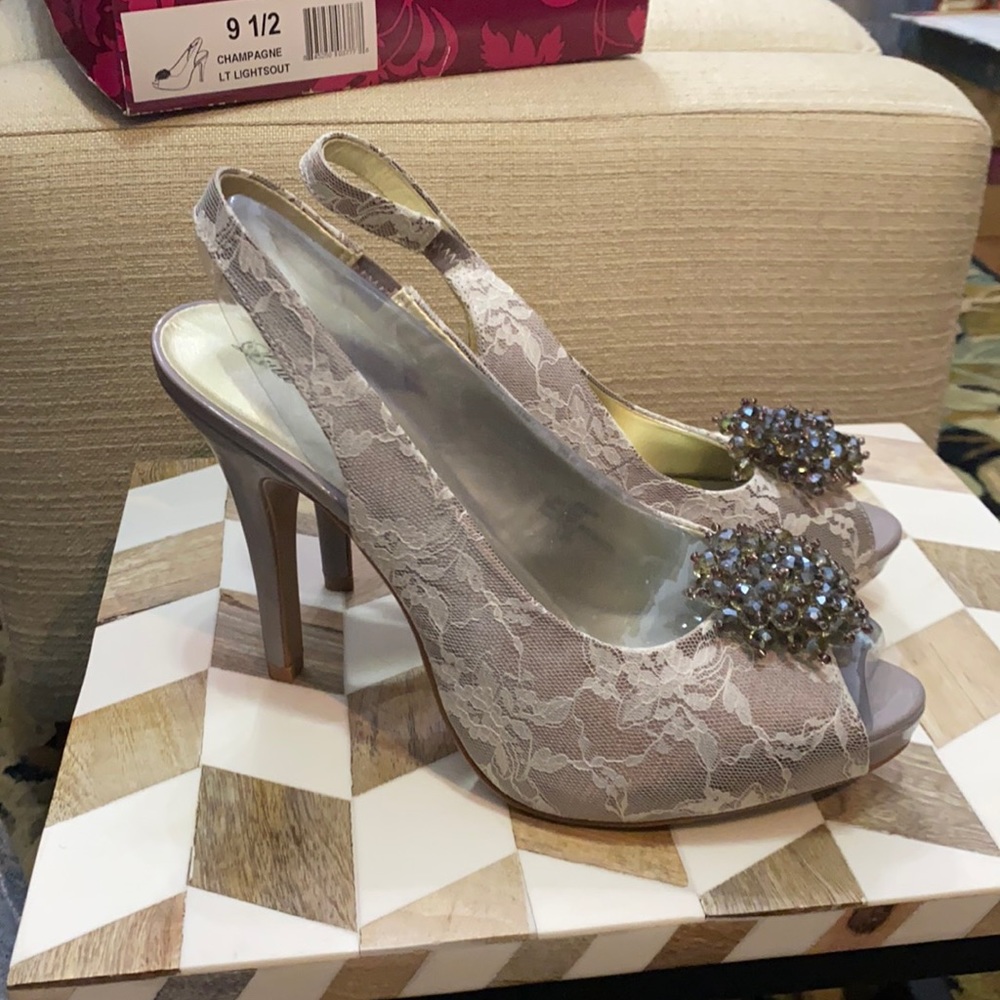 Lace peep-toe in taupe with crystal embellishments.